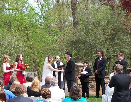 Fr. Geof preforming a lovely outdoor wedding.